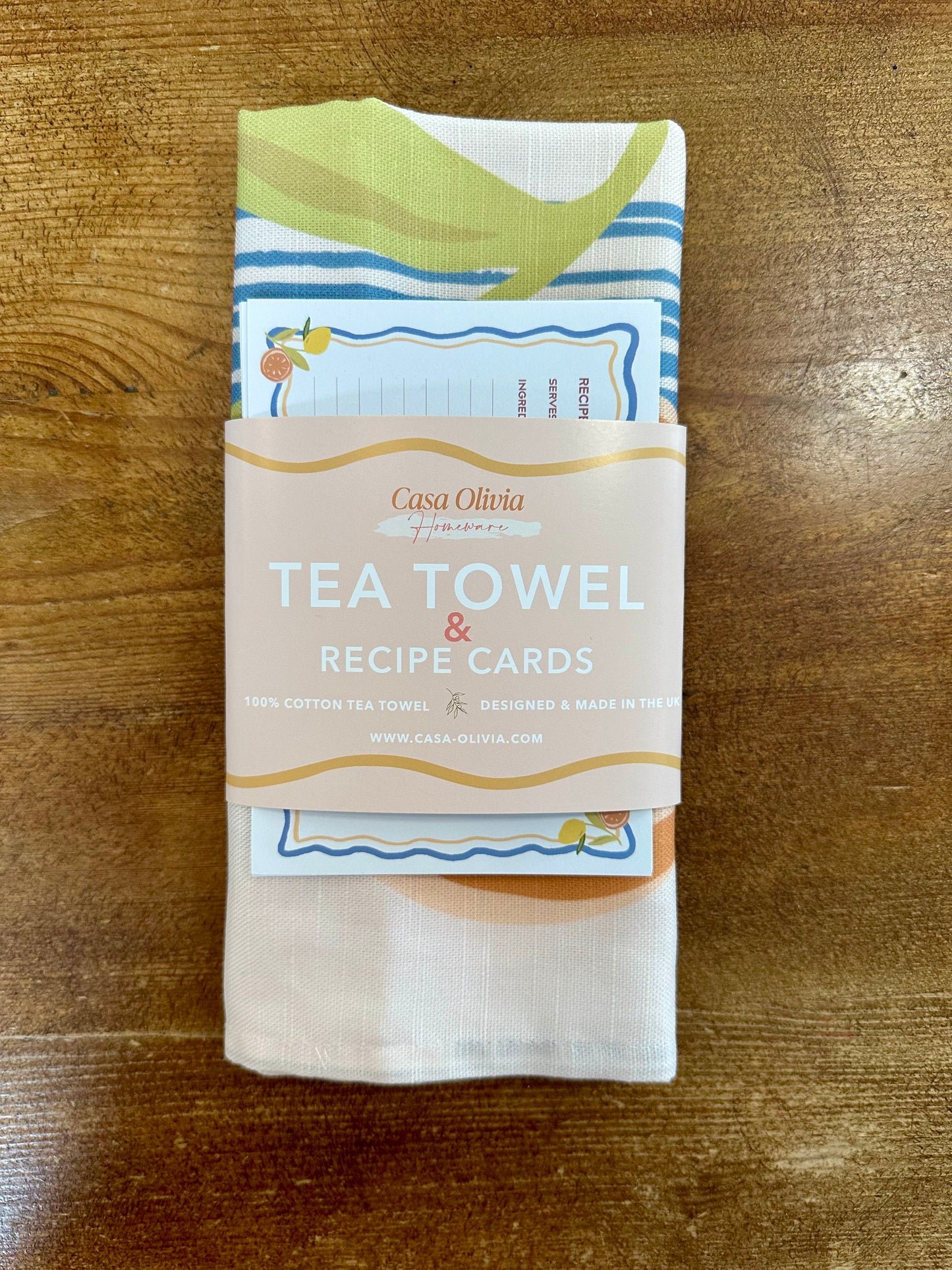Tea towel folded in packaging on table