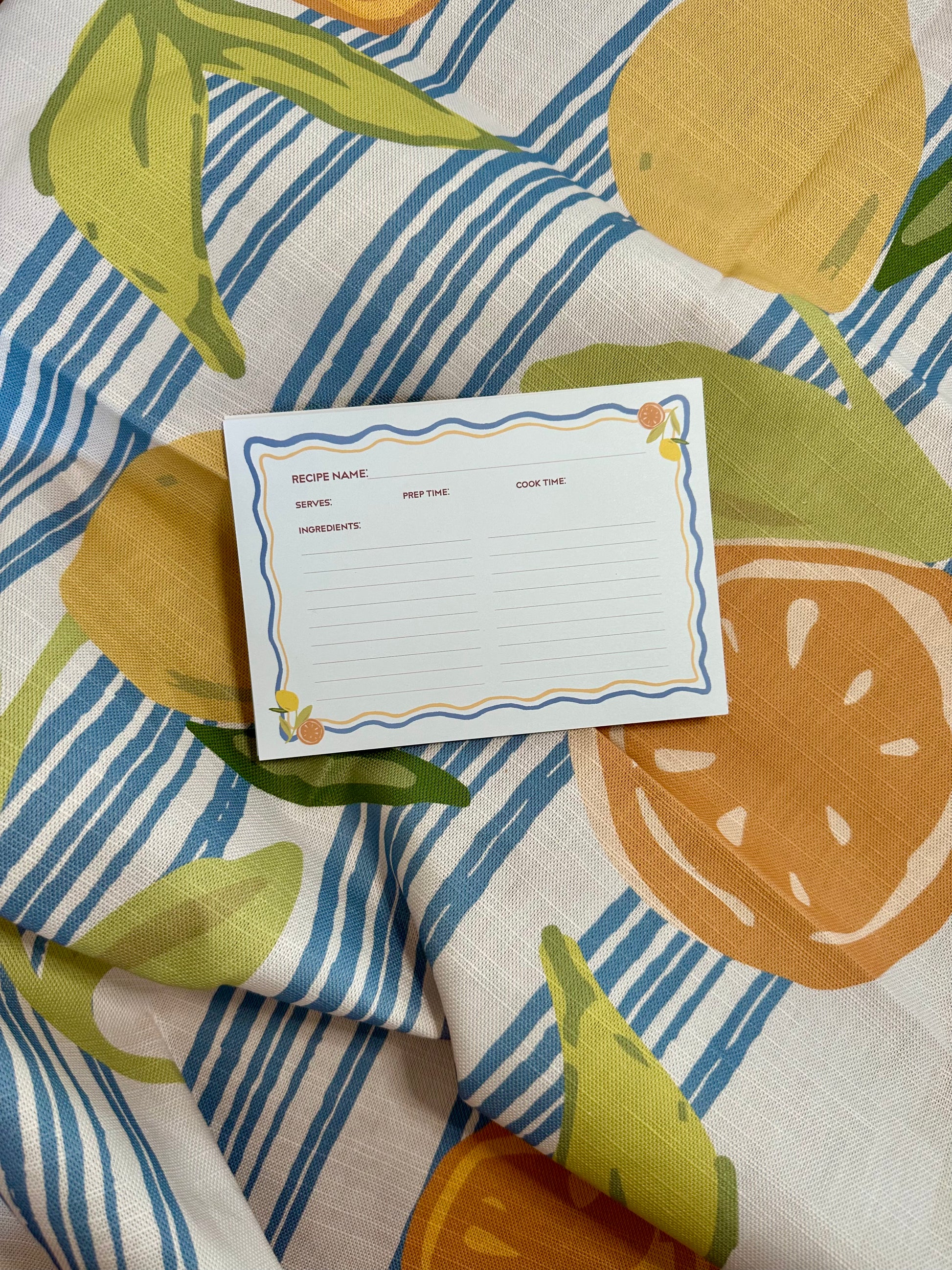 Recipe cards on a colourful Casa Olivia Tea Towel